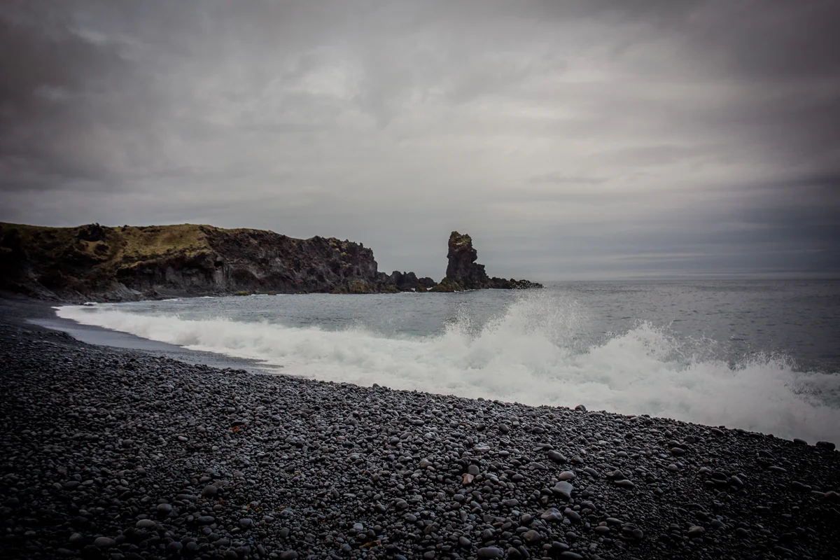 Crashing waves on a black volcanic beach in Iceland