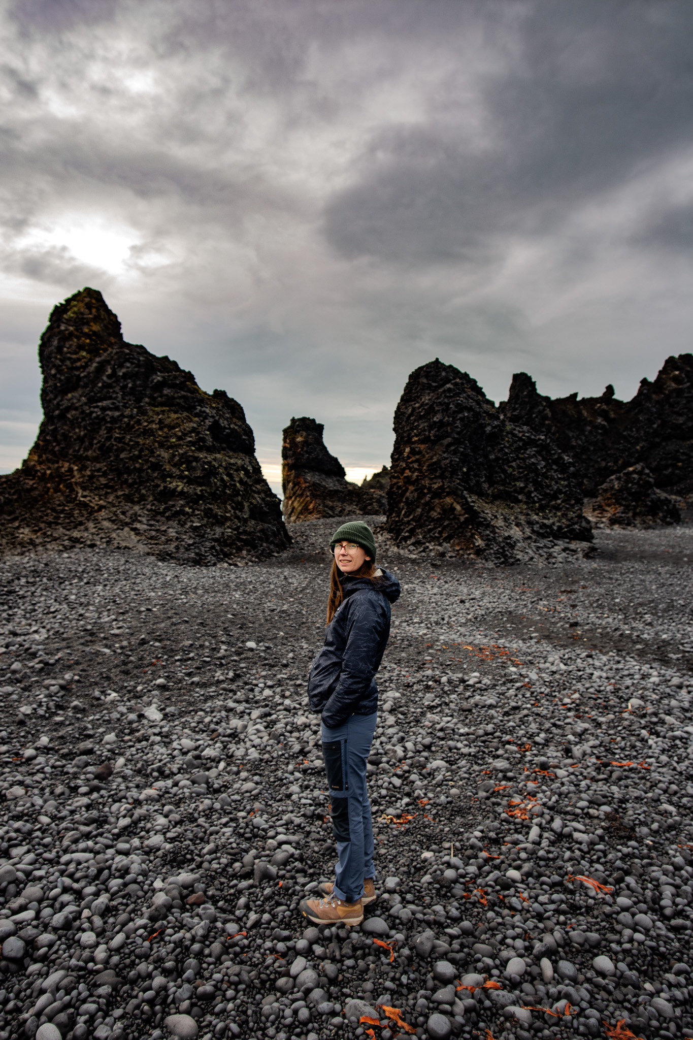 Anna between the Lóndrangar sea stacks, Snæfellsnes Iceland